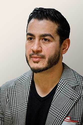 Abdul El-Sayed (center) with supporters in Detroit